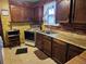 Functional kitchen with vintage appliances, wooden cabinets, and a cozy, retro aesthetic at 3036 W Clyde Pl, Denver, CO 80211