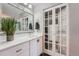 Beautiful bathroom with ample counter space, cabinets, and a glass enclosed shower at 3752 S Helena Way, Aurora, CO 80013