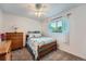 This bedroom is complete with a bed, dresser and a window letting in lots of light at 3752 S Helena Way, Aurora, CO 80013