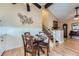 Charming dining area with a glass table, seating for four, and hardwood floors at 3752 S Helena Way, Aurora, CO 80013