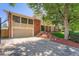 Charming brick home with well-manicured lawn, a driveway and basketball hoop for outdoor fun at 3752 S Helena Way, Aurora, CO 80013