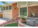 Inviting brick home entrance with manicured landscaping and a charming floral pot, perfect curb appeal at 3752 S Helena Way, Aurora, CO 80013