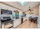 Bright kitchen with white cabinets, stainless steel appliances, and a cozy breakfast nook at 3752 S Helena Way, Aurora, CO 80013