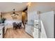 Eat-in kitchen features white cabinets, granite countertops, and a modern stainless steel refrigerator at 3752 S Helena Way, Aurora, CO 80013
