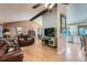 Open-concept living room featuring hardwood floors and vaulted ceilings for a spacious feel at 3752 S Helena Way, Aurora, CO 80013