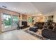 Inviting living room with a cozy fireplace, tile floors, and French doors to the backyard at 3752 S Helena Way, Aurora, CO 80013