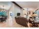 Open living area with hardwood floors, comfortable seating, and seamless flow to dining space at 3752 S Helena Way, Aurora, CO 80013