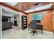 Home office featuring neutral colors, a large window, and a door to another room at 3752 S Helena Way, Aurora, CO 80013