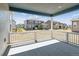 Covered back patio overlooking neighborhood homes and sunny skies at 1784 Morgan Dr, Erie, CO 80516