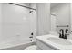 Bathroom featuring white subway tile, black hardware, and a modern vanity at 1784 Morgan Dr, Erie, CO 80516