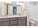 Neutral bathroom with tub and shower and double granite counter vanity at 1784 Morgan Dr, Erie, CO 80516