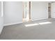 Large bedroom with carpet and multiple doorways at 1784 Morgan Dr, Erie, CO 80516