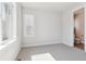 A light and airy bedroom with plush carpeting, ample natural light, and ensuite bathroom at 1784 Morgan Dr, Erie, CO 80516