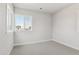 Neutral bedroom with soft carpet and natural light from the double windows at 1784 Morgan Dr, Erie, CO 80516