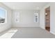 Bright bedroom with neutral walls, carpet, and natural light from the windows at 1784 Morgan Dr, Erie, CO 80516