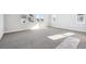 Large, sunlit bedroom with neutral carpet and windows overlooking the neighborhood at 1784 Morgan Dr, Erie, CO 80516