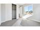 Light-filled bedroom with a sliding door closet and a large window at 1784 Morgan Dr, Erie, CO 80516