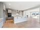 Spacious kitchen with gray cabinets, a central island, and stainless steel appliances at 1784 Morgan Dr, Erie, CO 80516