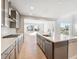 Bright kitchen with a central island, stainless steel appliances, and modern cabinetry at 1784 Morgan Dr, Erie, CO 80516