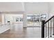 Bright living space with wood floors and sliding glass doors bringing the outside in at 1784 Morgan Dr, Erie, CO 80516
