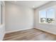 Bright and airy room features hardwood floors and large windows with a neighborhood view at 1784 Morgan Dr, Erie, CO 80516