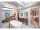 Relaxing bathroom with soaking tub, double vanity and views to bedroom and closet at 377 Albion St, Denver, CO 80220