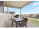 Covered outdoor deck space with a table and seating, ideal for outdoor dining and relaxation at 6196 Leilani Dr, Castle Rock, CO 80108