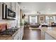 Open concept kitchen and living room with hardwood floors and lots of natural light at 6196 Leilani Dr, Castle Rock, CO 80108