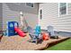 Play area featuring pea gravel, play set and Adirondack chairs at 6196 Leilani Dr, Castle Rock, CO 80108