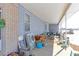 Spacious back porch, outdoor living area with comfortable seating at 409 N Garden Ct, Platteville, CO 80651