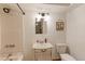 Cozy bathroom featuring a vanity sink, toilet, and shower at 409 N Garden Ct, Platteville, CO 80651