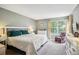 Relaxing bedroom with a large window and soft, neutral tones at 1563 S Trenton Ct, Denver, CO 80231