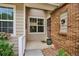 Inviting front porch with charming details and flower boxes, offering a warm welcome at 1563 S Trenton Ct, Denver, CO 80231