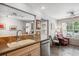 Cozy space features a tile floor, a window and stainless steel dishwasher at 1563 S Trenton Ct, Denver, CO 80231