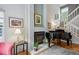 Elegant living room featuring a fireplace and grand piano at 1563 S Trenton Ct, Denver, CO 80231