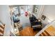 Aerial view of living room features piano, fireplace, and a sliding glass door to backyard at 1563 S Trenton Ct, Denver, CO 80231