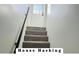 Carpeted stairway leading up to a bright, modern entrance, framed by white walls at 3081 Zion St, Aurora, CO 80011