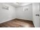 Bedroom with hardwood floors and natural light from the windows at 5167 Sable St, Denver, CO 80239