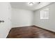 Bright bedroom with hardwood floors and natural light from the window at 5167 Sable St, Denver, CO 80239