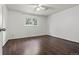 Cozy bedroom featuring hardwood floors, a ceiling fan, and a bright window with natural light at 5167 Sable St, Denver, CO 80239