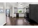 Kitchen with modern appliances, white cabinetry, and hardwood floors, ready for cooking and entertaining at 5167 Sable St, Denver, CO 80239
