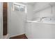 Laundry room with washer and dryer and a view of the shower-tub combo at 5167 Sable St, Denver, CO 80239