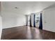 Spacious living room with hardwood floors, natural light, and white walls ready for personalization at 5167 Sable St, Denver, CO 80239
