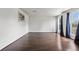 Bright, spacious living room featuring hardwood floors and large windows with nice curtain accents at 5167 Sable St, Denver, CO 80239