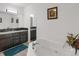 Bright bathroom featuring a soaking tub and double vanity with plenty of counter space at 18553 County Road 5, Berthoud, CO 80513