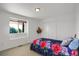 Bedroom featuring modern decor and a bright sunny window at 18553 County Road 5, Berthoud, CO 80513