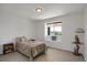 Bright bedroom featuring hard surface floors, a window nook, and a scenic view at 18553 County Road 5, Berthoud, CO 80513