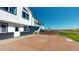 Two-story home featuring a brick foundation with a walk-out door, charming fountain and decorative statues at 18553 County Road 5, Berthoud, CO 80513