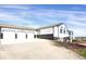 Charming two-story home with an attached three-car garage and a wide driveway for ample parking at 18553 County Road 5, Berthoud, CO 80513