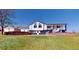 Charming two-story home with a three-car garage, beautiful brick accents, and an inviting entrance at 18553 County Road 5, Berthoud, CO 80513